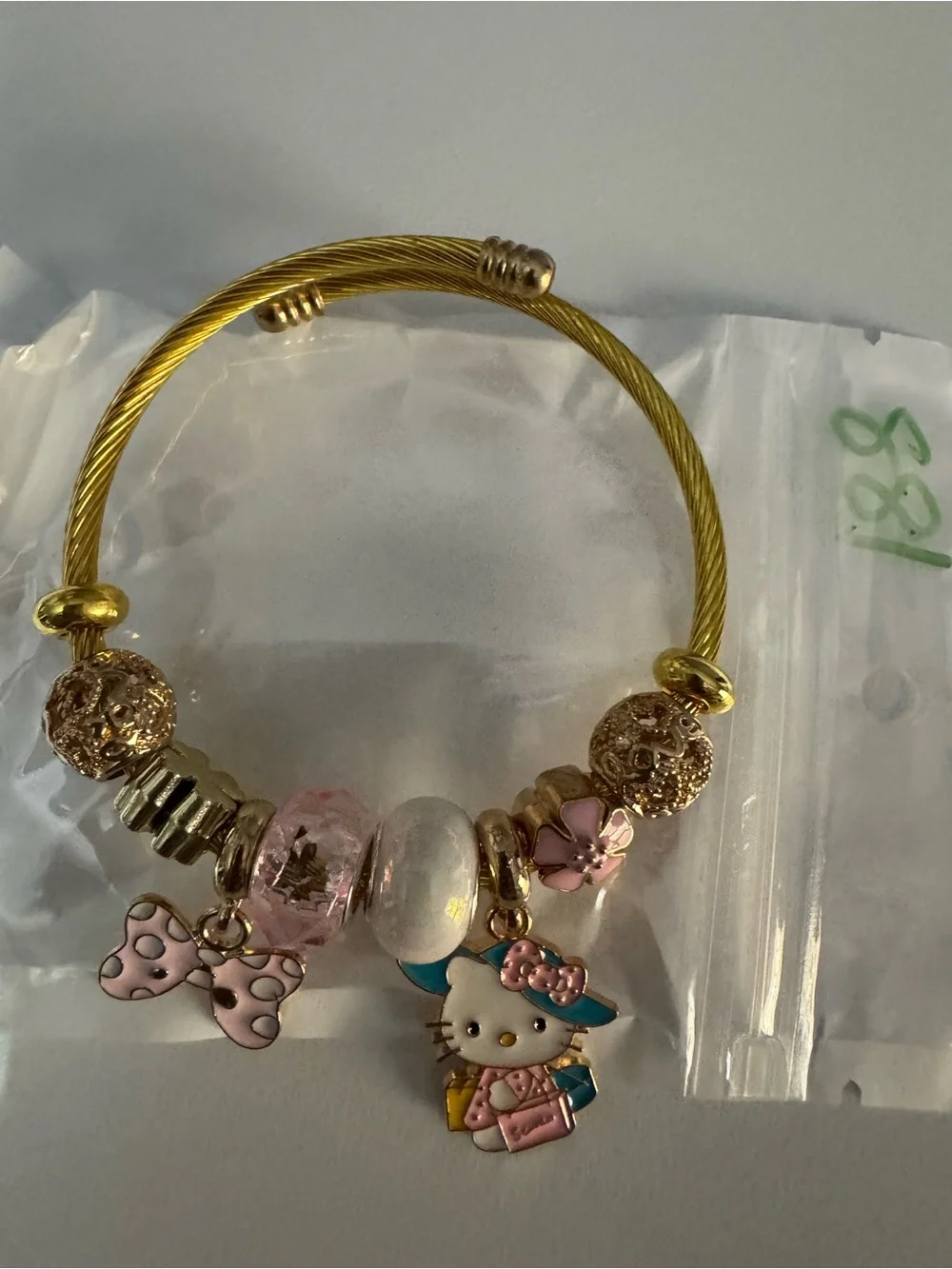 Hello Kitty Gold-Tone Charm Bracelet - Pink Accents